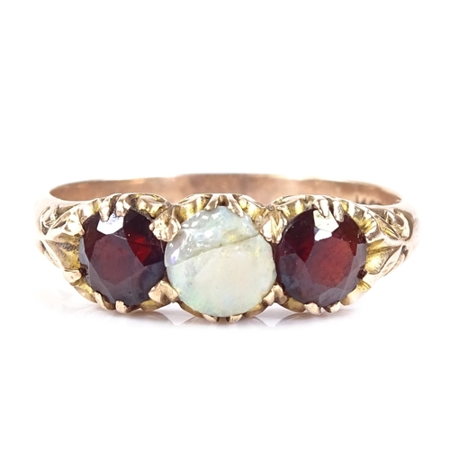 559 - A 14ct rose gold 3-stone opal and garnet half-hoop ring, engraved foliate bridge and shoulders, sett... 