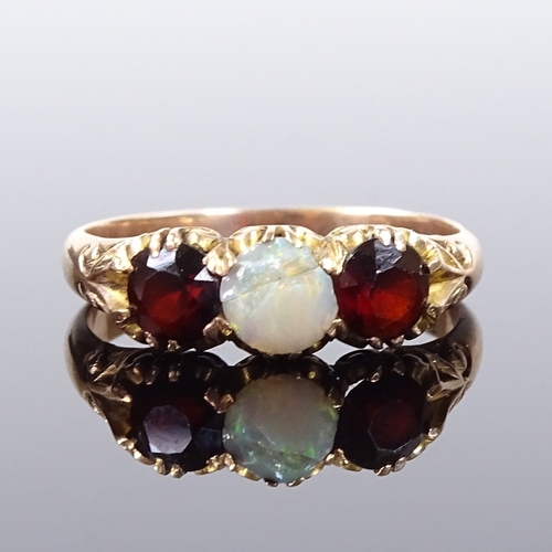 559 - A 14ct rose gold 3-stone opal and garnet half-hoop ring, engraved foliate bridge and shoulders, sett... 