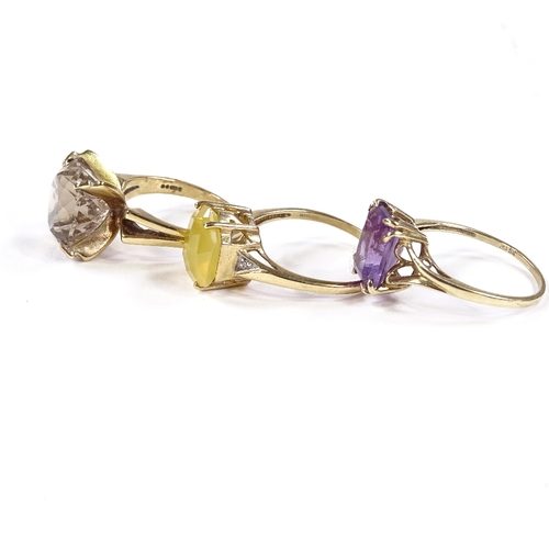 569 - 3 9ct gold stone set rings, comprising fire opal, smoky quartz and amethyst, 12.8g total (3)