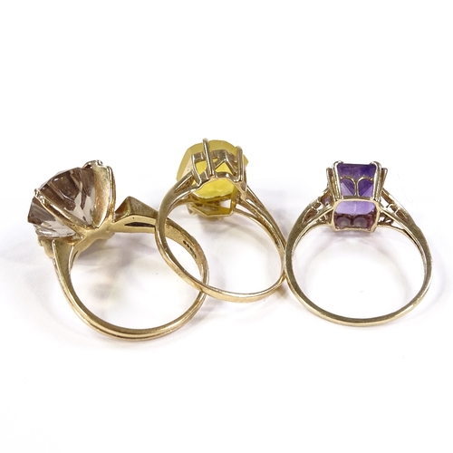 569 - 3 9ct gold stone set rings, comprising fire opal, smoky quartz and amethyst, 12.8g total (3)