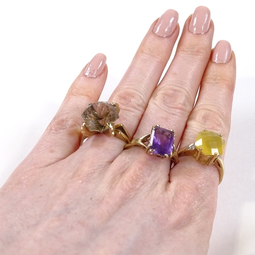 569 - 3 9ct gold stone set rings, comprising fire opal, smoky quartz and amethyst, 12.8g total (3)