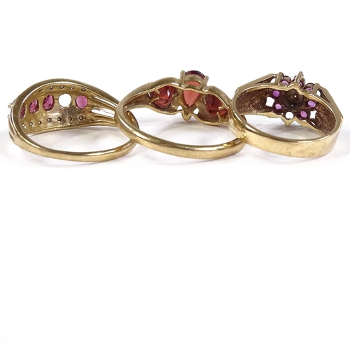 572 - 3 9ct gold stone set rings, including garnet, 8.7g total (3)