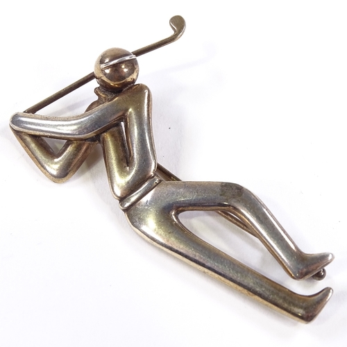 573 - An Evald Nielsen Danish silver figural golfer brooch, stylised form, maker's marks En, 830 S standar... 