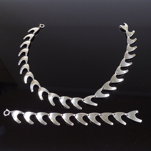 575 - A Carl Ove Frydensberg Danish sterling silver matching necklace and bracelet, of plain boomerang for... 