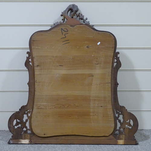 304 - A carved and shaped walnut-framed over mantel mirror, circa 1900, height 3'11