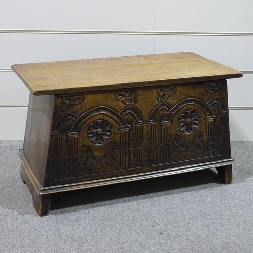 307 - A good quality reproduction carved oak coffer of plank construction, width 2'11