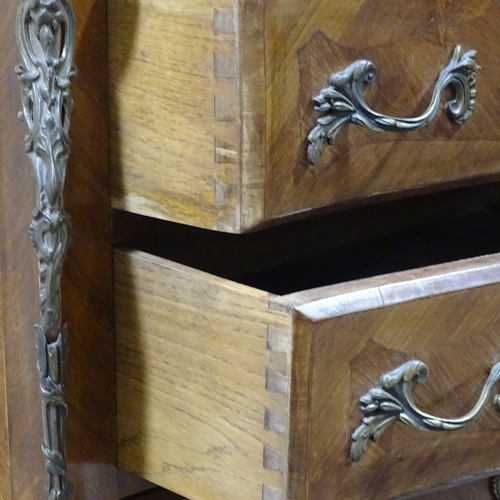 310 - A French walnut and kingwood bombe commode with shaped marble top, width 3'4