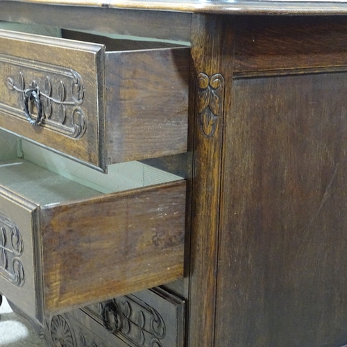 318 - A 19th century French oak 3-drawer commode with relief carved drawer fronts, width 3'7