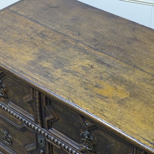 324 - An early 18th century joined oak chest of 3 long drawers, with moulded fielded panelled drawer front... 