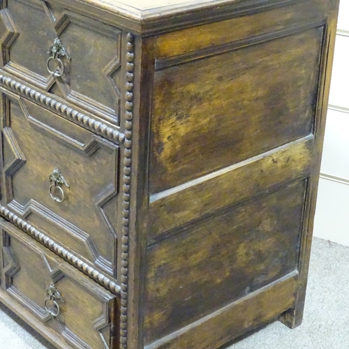 324 - An early 18th century joined oak chest of 3 long drawers, with moulded fielded panelled drawer front... 