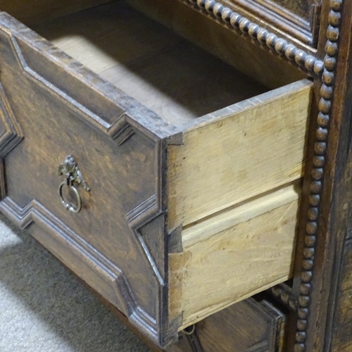 324 - An early 18th century joined oak chest of 3 long drawers, with moulded fielded panelled drawer front... 