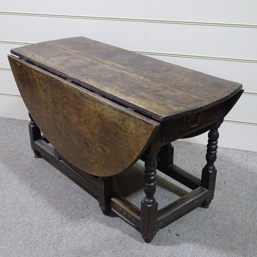 333 - An 18th century oak oval gateleg dining table, 4'2