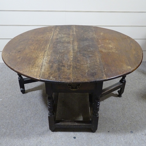 333 - An 18th century oak oval gateleg dining table, 4'2