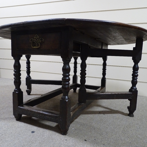 333 - An 18th century oak oval gateleg dining table, 4'2