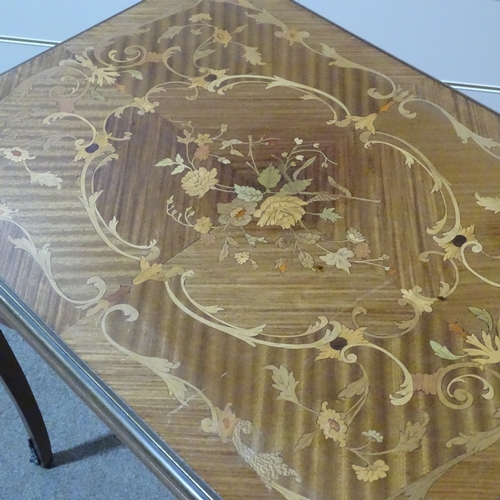 334 - An Italian walnut and floral marquetry inlaid fold over games table, with ormolu mouldings and mount... 