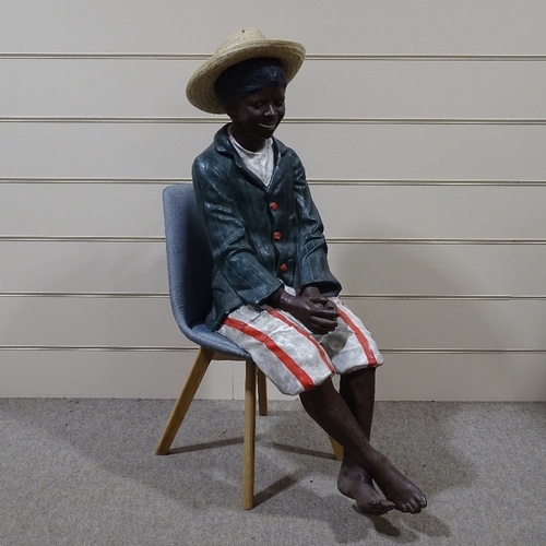 337 - A life size painted plaster advertising shoeshine boy figure