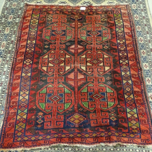 344 - A Turkish red ground wool rug, geometric patterns and border, 200cm x 155cm