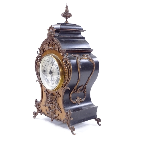 433 - A late 19th century mantel clock with allover ornate cast-brass moulding and mounts, engraved silver... 