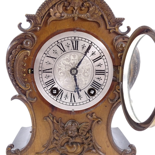 433 - A late 19th century mantel clock with allover ornate cast-brass moulding and mounts, engraved silver... 