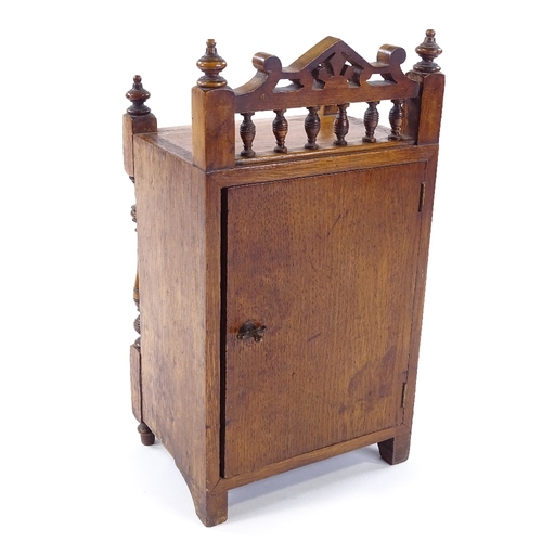 439 - A Victorian carved oak-cased mantel clock, 8-day movement striking on a bell, height 32cm