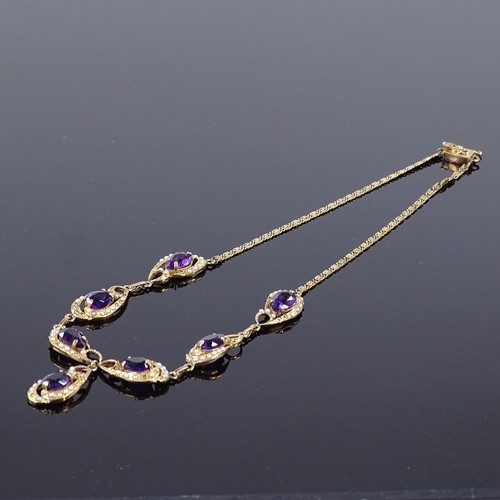 502 - A 14ct gold amethyst and split pearl collar necklace, pierced and scrolled decoration with pear-cut ... 