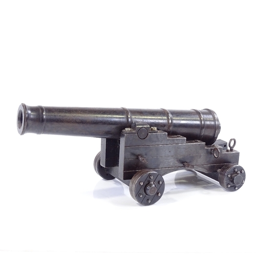 213 - A scratch-built metal model field cannon on metal carriage base, overall length 19cm