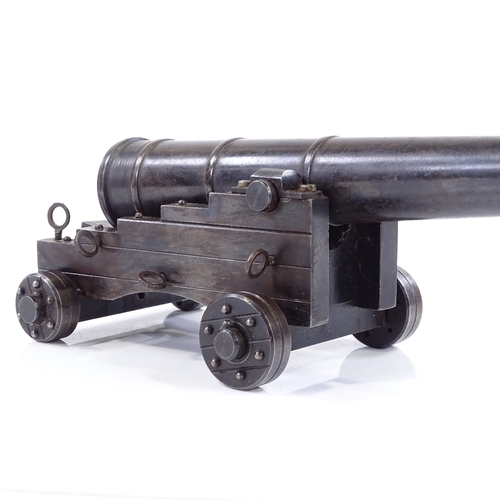 213 - A scratch-built metal model field cannon on metal carriage base, overall length 19cm