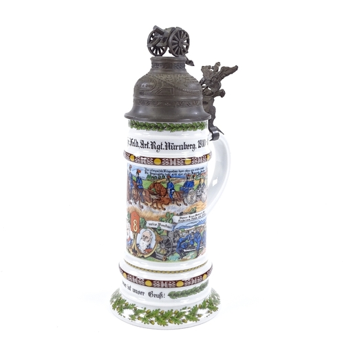 216 - A Kaiser porcelain beer stein with transfer decorated military scenes, and pewter lid surmounted by ... 