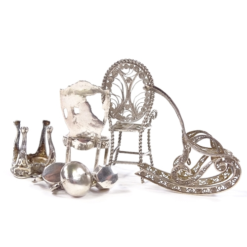 660 - A group of Continental silver dolls house furniture, including filigree rocking chair, Dutch side ch... 