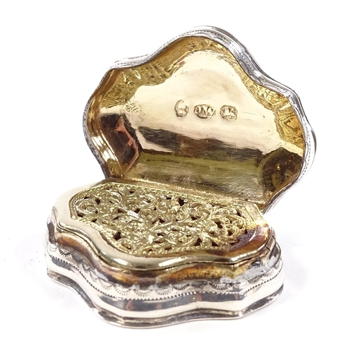 663 - A George III silver vinaigrette, of shaped form with floral engraved decoration, gilt interior with ... 