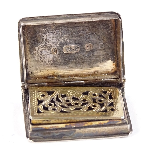 664 - A William IV silver novelty book vinaigrette, engine turned decoration with vacant cartouche, ribbed... 