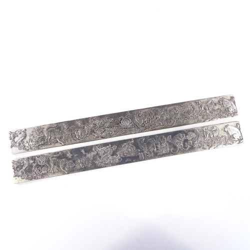 669 - A pair of Chinese export silver rectangular scroll weights, depicting relief 12 Chinese zodiac anima... 