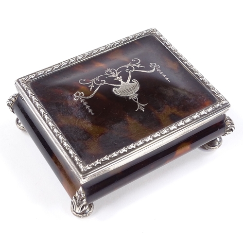 671 - An Edwardian rectangular tortoiseshell and silver pique inlay jewel box, with Adams style decoration... 