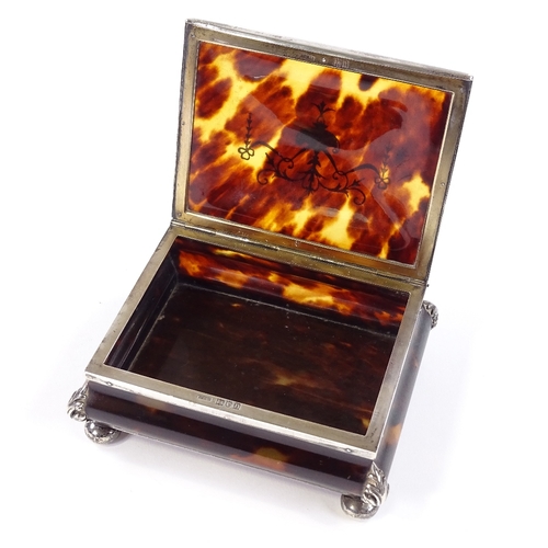 671 - An Edwardian rectangular tortoiseshell and silver pique inlay jewel box, with Adams style decoration... 