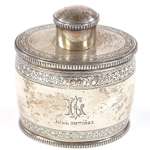 672 - A late Victorian oval barrel-shaped silver tea caddy, with engraved floral and acorn decoration with... 