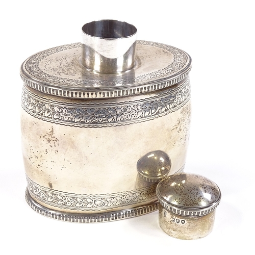 672 - A late Victorian oval barrel-shaped silver tea caddy, with engraved floral and acorn decoration with... 