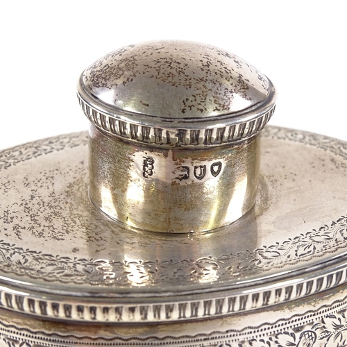 672 - A late Victorian oval barrel-shaped silver tea caddy, with engraved floral and acorn decoration with... 