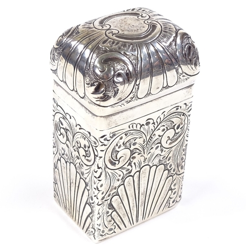 673 - An Edwardian rectangular silver dome-top tea caddy, relief embossed fluted and foliate decoration, g... 