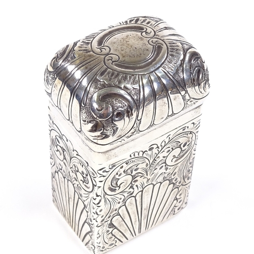 673 - An Edwardian rectangular silver dome-top tea caddy, relief embossed fluted and foliate decoration, g... 