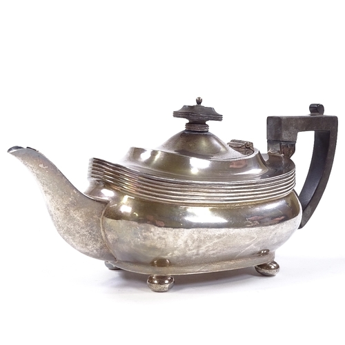 690 - A George V silver teapot, oval squat form with bun feet, by Joseph Rodgers & Sons, hallmarks Sheffie... 