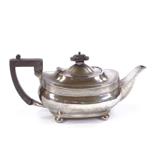 690 - A George V silver teapot, oval squat form with bun feet, by Joseph Rodgers & Sons, hallmarks Sheffie... 