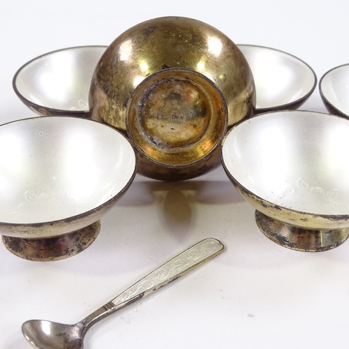 700 - A set of 7 Volmer Bahner Danish vermeil silver and white enamel salt bowls, and a matching spoon, ma... 