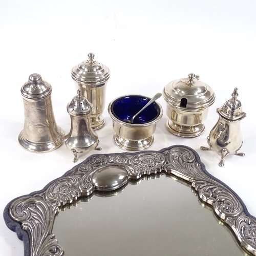 701 - Various silverware, including 3-piece cruet set by Garrard & Co Ltd, plated mirror etc (7)