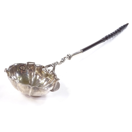 711 - A George II silver toddy ladle, with scalloped bowl, original engraved initials and twisted whale bo... 