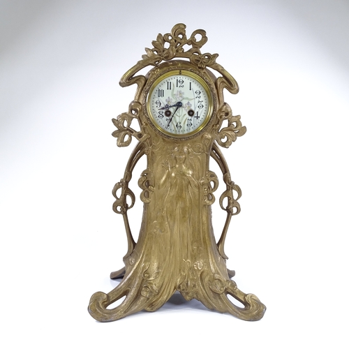 444 - A French Art Nouveau gilded spelter-cased mantel clock, ornate stylised case with relief moulded fem... 