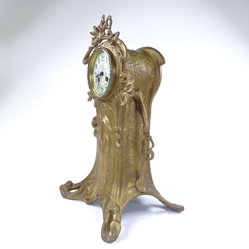 444 - A French Art Nouveau gilded spelter-cased mantel clock, ornate stylised case with relief moulded fem... 