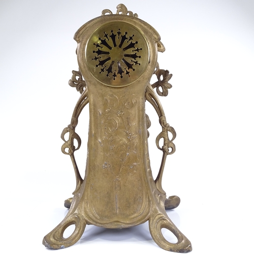 444 - A French Art Nouveau gilded spelter-cased mantel clock, ornate stylised case with relief moulded fem... 