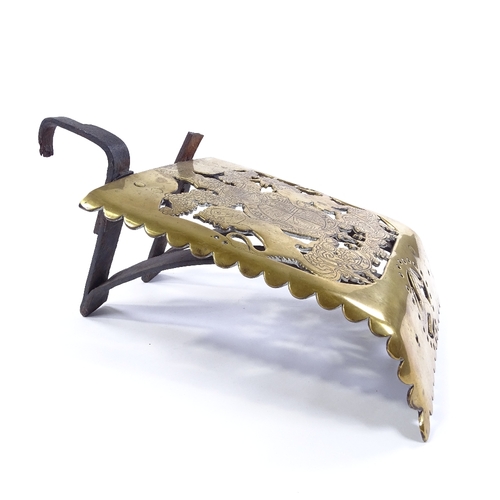 103 - A pierced and engraved brass coach step, 18th/19th century, with wrought-iron brackets, Royal armori... 