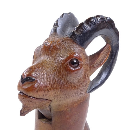 34 - A Tyrolean carved wood ibex design nutcracker with glass eyes, length 21cm