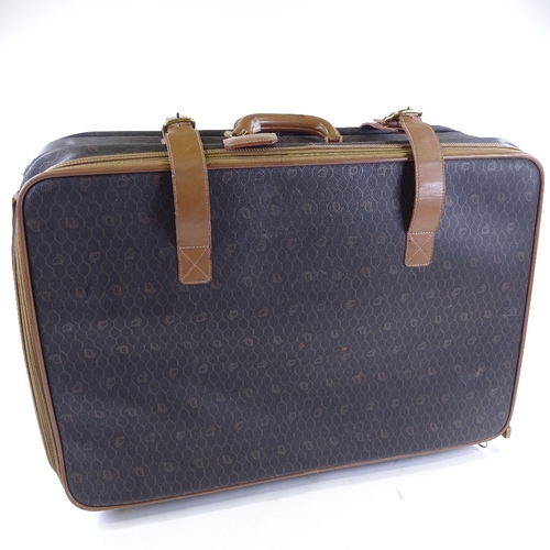 65 - CHRISTIAN DIOR - a Vintage Honeycomb Monogram roll along travel bag / suitcase, circa 1970s, coated ... 